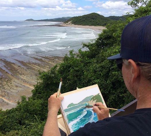 Wade painting plein air somewhere tropical. 